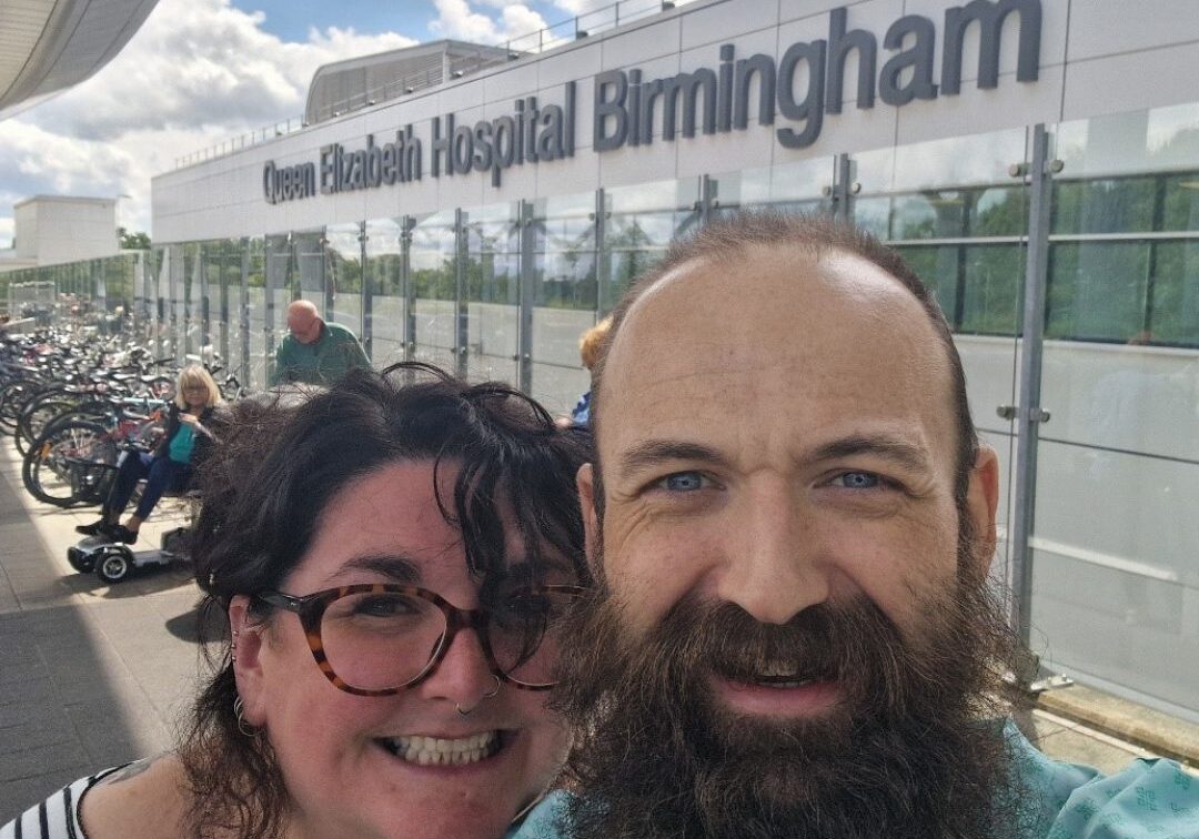 Stewart and his wife outside Queen Elizabeth Hospital Birmingham