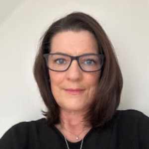 ImgCk20231026_web Claire with brown shoulder length hair, classes, looking directly to camera